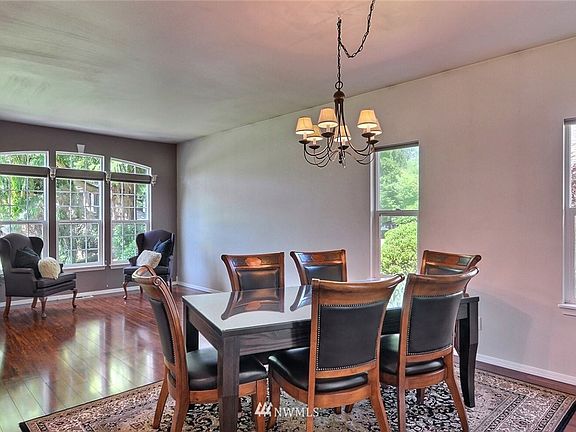 High ceilings, large windows and an open living room to the dining room for  flexibility!