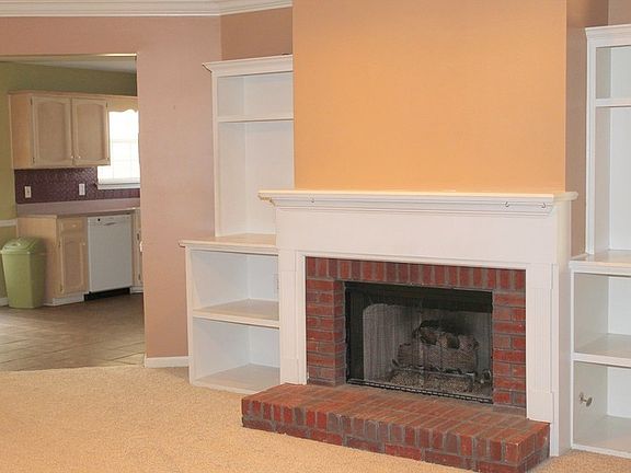 Fireplace
						:
						Built-in shelving surrounding fireplace; pre-wired for surround-sound