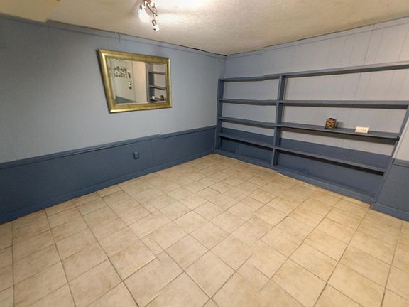 Lower level den (finished basement) Can be used as bedroom.