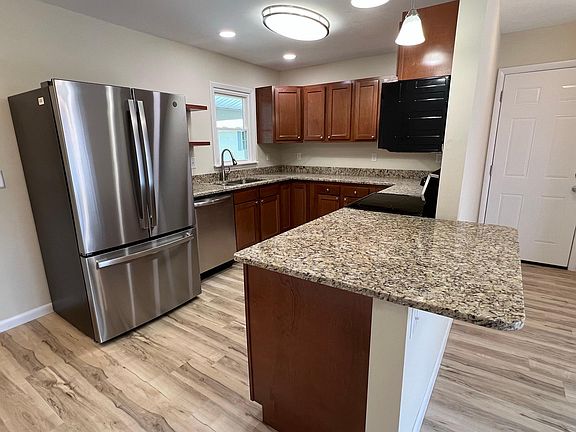 Kitchen overlooks dining/rec room.