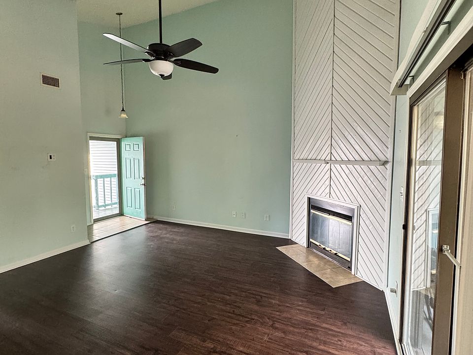 Open living space with high ceilings and plenty of natural light