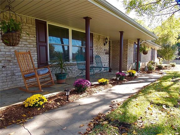 Nice covered front porch to sit and relax while watching the sunset