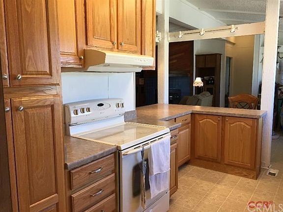 Large Kitchen with electric stove and dimming lights