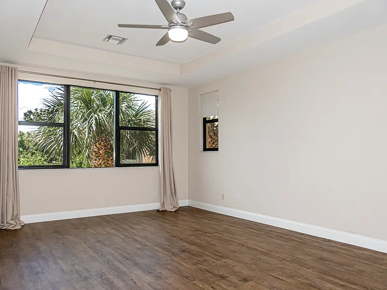 Master Bedroom, oversized. Awesome sunset views over water. LVT flooring throughout. New ceiling fan