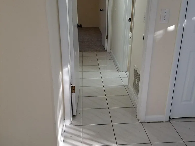 Hallway to bedrooms and bathrooms. Can be closed for privacy.