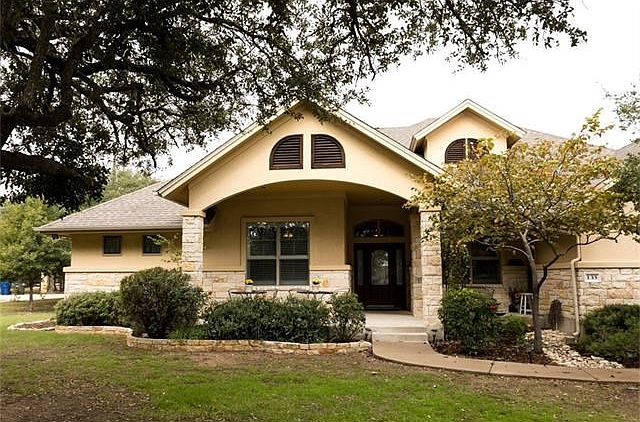 Beautiful home nestled under 30ft Oak Trees make your front entrance enchanting to walk into! Ready for holiday lighting!  :)