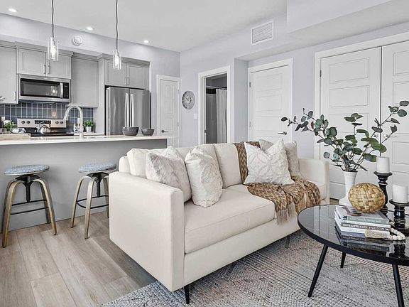 A photo of the great room of the Coltrane townhome model by Brookfield Residential