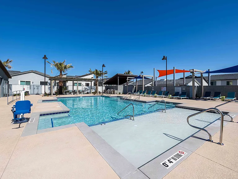 Relax and unwind in this luxury outdoor pool setting, perfect for summer days.