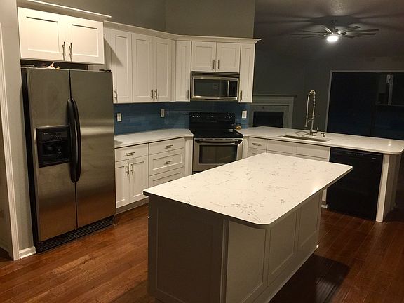 Glass subway tile backsplash