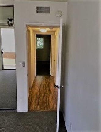 LONG HALL SEPARATES TWO KING-SIZED BEDROOMS