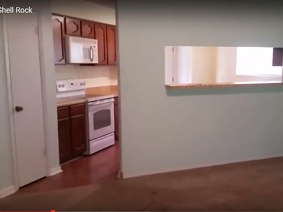 Kitchen overlooks the livingroom.