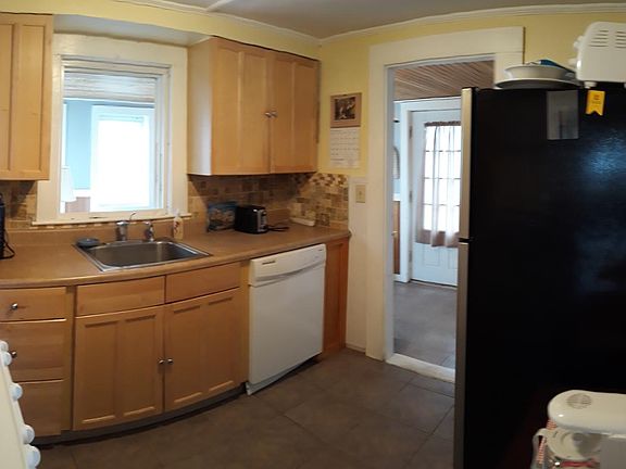 Kitchen looking towards heated porch