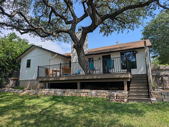 The backyard features a brand new oversized deck!