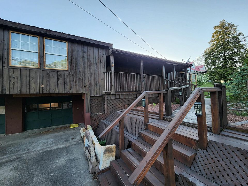 Front of house- 2 car garage and porch