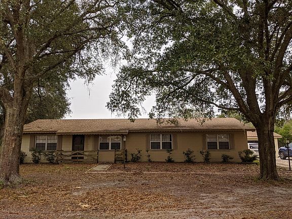 Front of house with garage in background