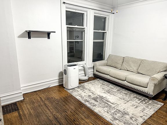 Plush Couch & Rug, and Powerful AC Unit