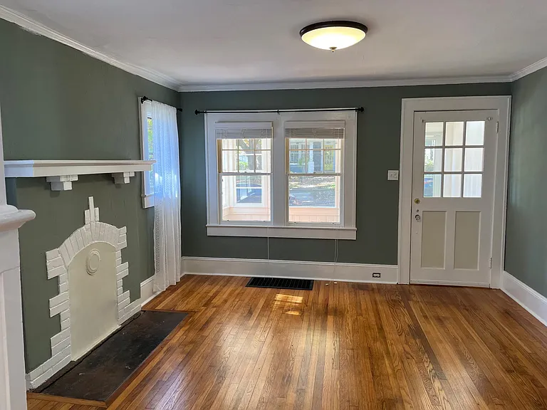 From the porch, you enter the living room which measures 13' x 14'. Living room looking towards the front door and four-season porch.