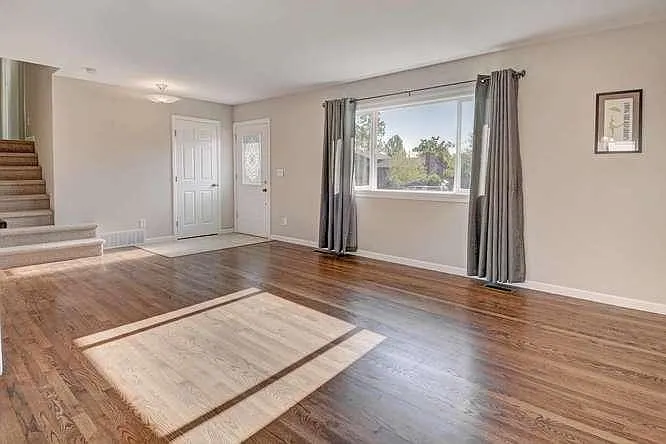 Entry, and living area with large window for lots of light,