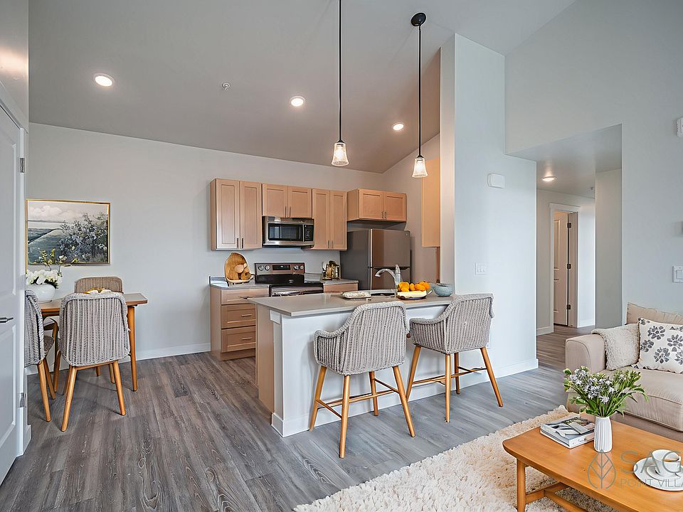 Sage Point Village Apartments - Staged Photo of Living Room, Dining Room and Kitchen