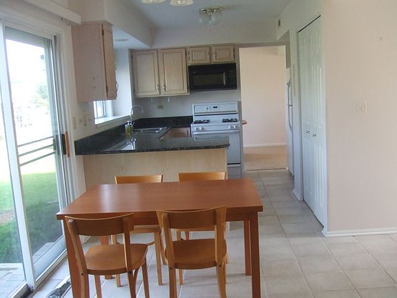 kitchen with ceramic tile and granite coutertops