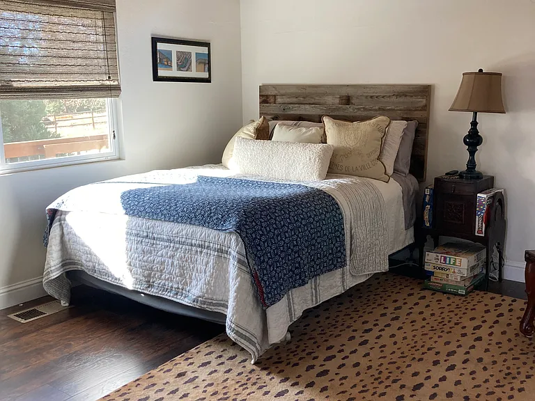 Second bedroom. Custom Window coverings. Queen bed.