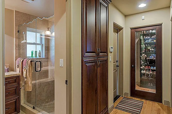 Split view of guest bathroom and hallway