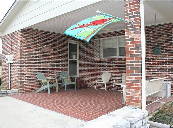 Convenient covered patio for family gatherings.