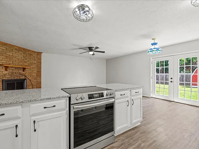 Open concept. (Fireplace will be white and have a new mantle)
