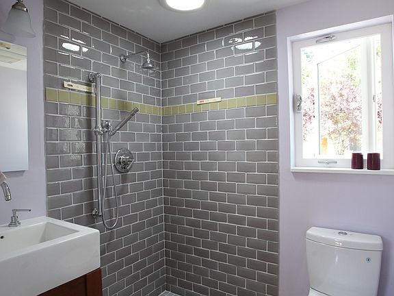 Fireclay recycled glass tile throughout the bath.  Ronbow sink and Toto toilet