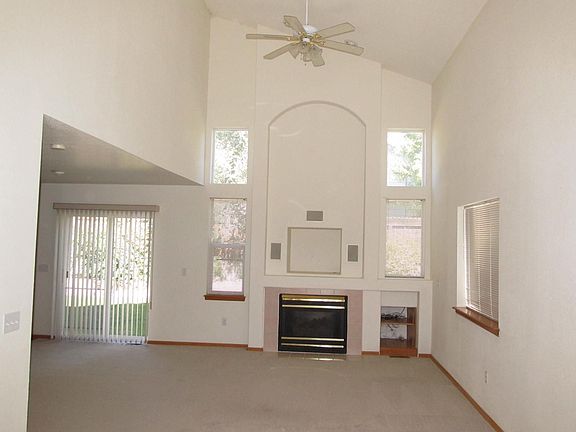 Family room with vaulted ceiling and fireplace