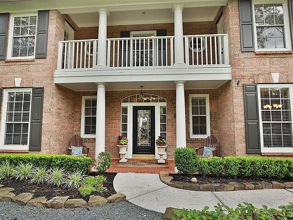Beautiful landscaped front and backyard, covered porch and balcony.