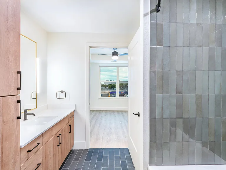Modern finishes and premium details such as Brizo faucets create a bathroom that's stylish and functional.