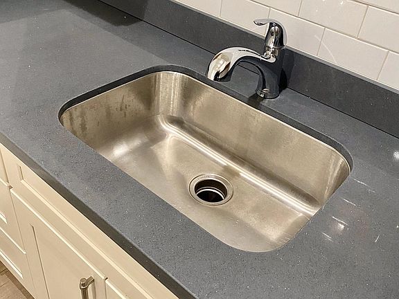 Quartz Counters, Undermount Sink, White Subway Tiles