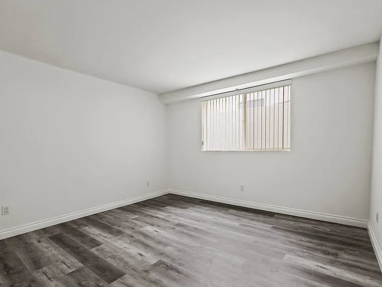 Large-Size Bedroom with Vinyl Flooring and Windows