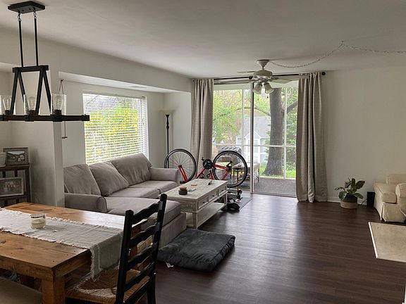 Current photo with updated flooring and furniture