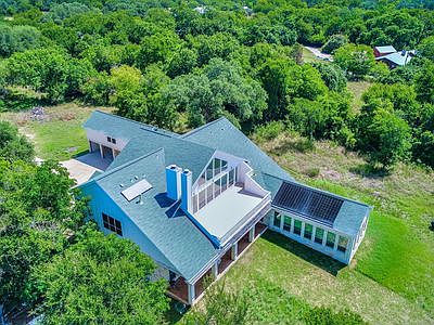 Rear aerial shows the pool