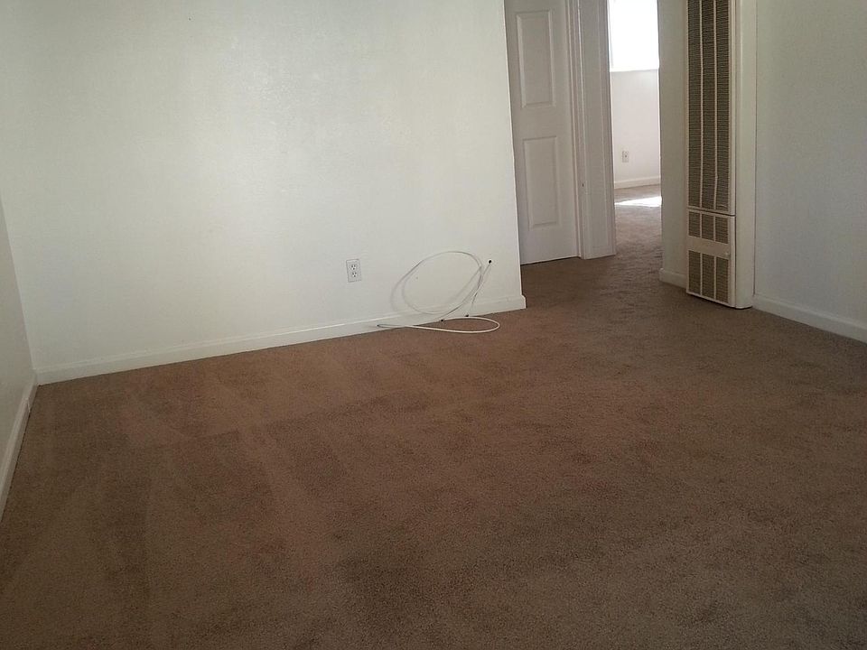 Living room with wall heater and AC