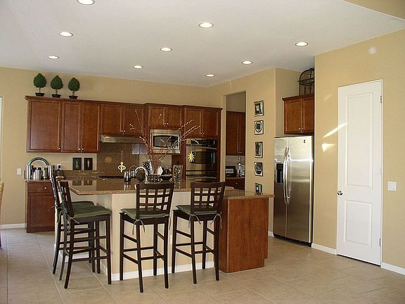 Chefs dream kitchen has slab granite butler and walk-in pantries.