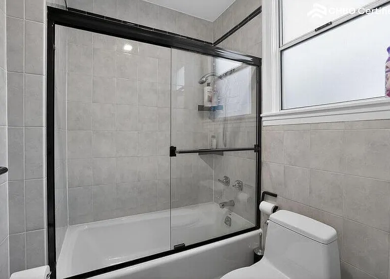 The main level on-suite bathroom has a shower over tub