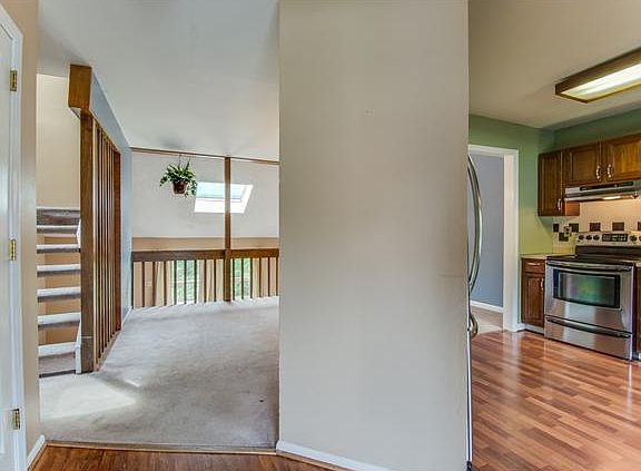 Foyer entry opens to kitchen and dining areas
