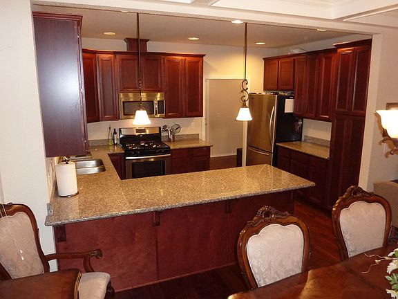 slab granite, SS appliances in kitchen
