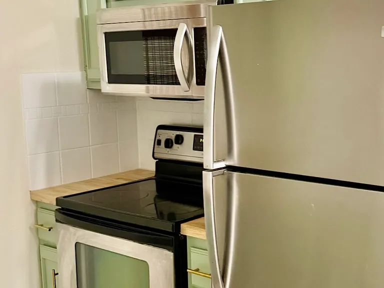 Remodeled kitchen with stainless steel appliances.