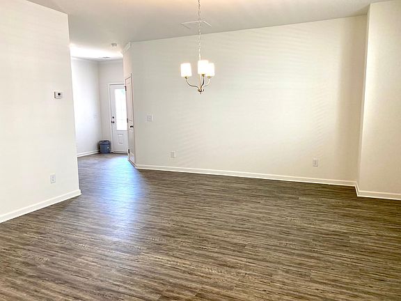 Dining room with LVP.