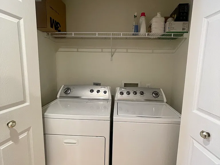 Laundry located upstairs in hallway between the two bedrooms