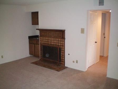 Living room with fireplace & wet bar