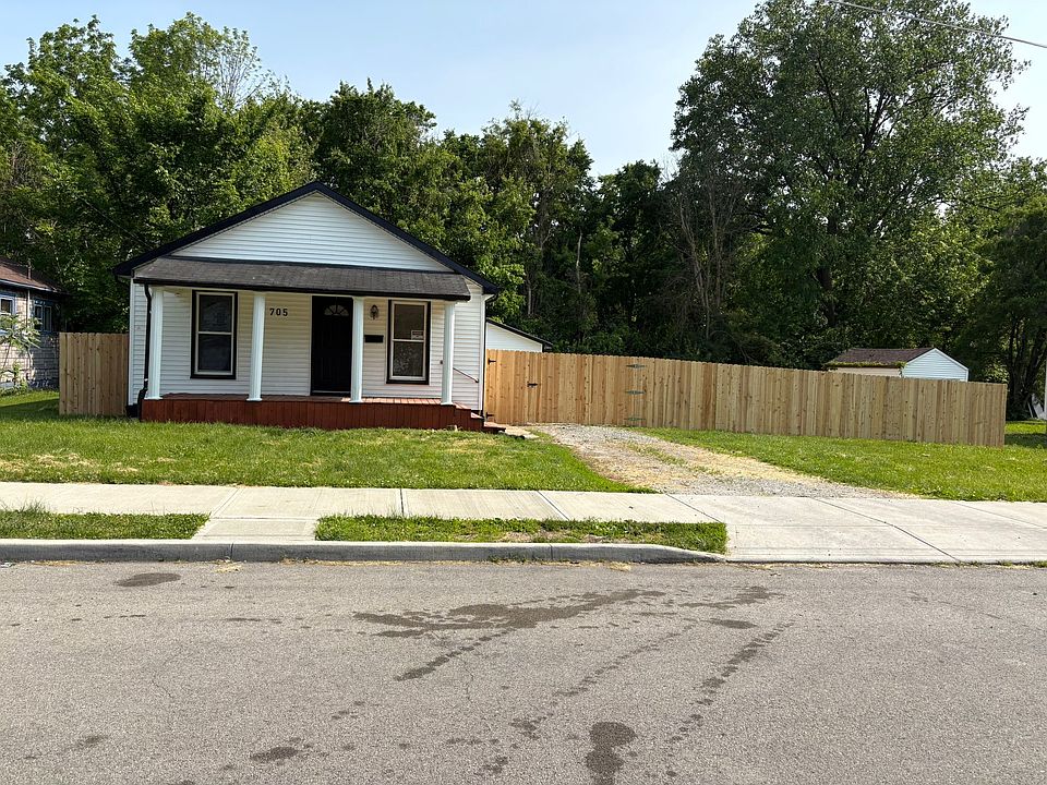 Front of the home with fenced yard