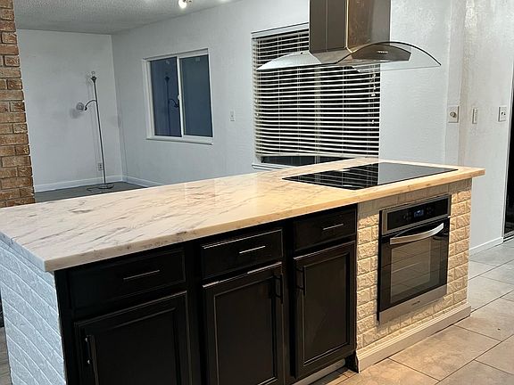 New island hood with stove top and oven