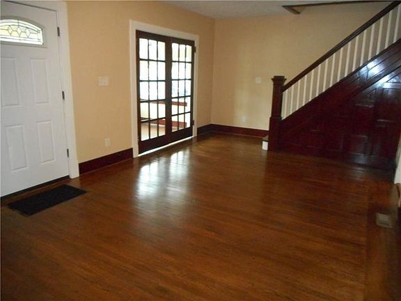 Living Room: You will find an array of exquisite features throughout this remarkable living room including gleaming woodwork and
