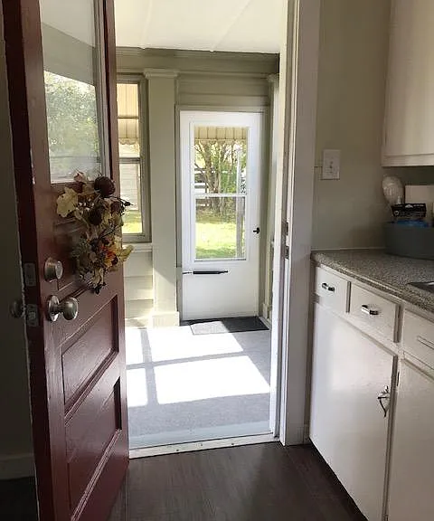 back door in kitchen, looking into screened in room