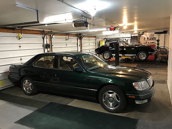 Three car garage with lift.